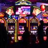 Attendees wander by the new Ruby casino slot machines during the Global Gaming Expo on Tuesday, Sept. 30, 2014, at Sands Expo.