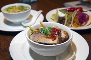 Pork ramen with tonkatsu broth, center, is shown at the Buffet at Wynn Tuesday, Sept. 30, 2014. The buffet recently added a Street Tacos station and a Ramen Noodle Bar.