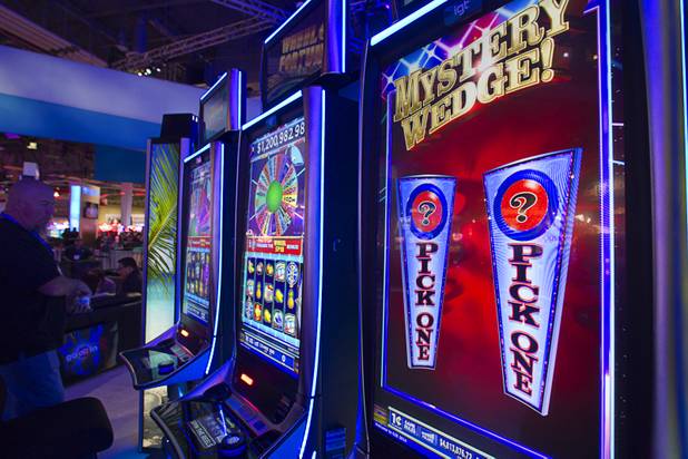 Wheel of Fortune slot machines are displayed at the IGT booth during the Global Gaming Expo (G2E) at the Sands Expo Center Thursday, Oct. 2, 2014.