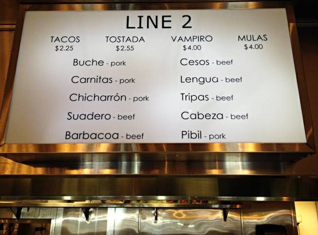 The sign above Line 2 at Taco y Taco on Eastern Avenue in Henderson. There are 14 different types of meat offered at Taco y Taco, but little description offered on the menu. 