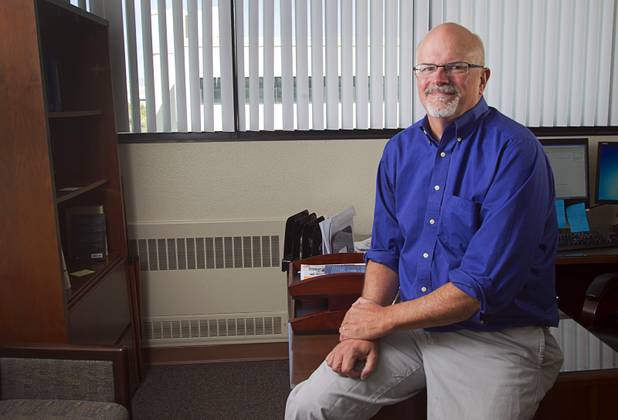 Edward Coulson, director of Lied Institute for Real Estate Studies and professor of economics, poses in his office at UNLV Wednesday, Oct. 22, 2014.