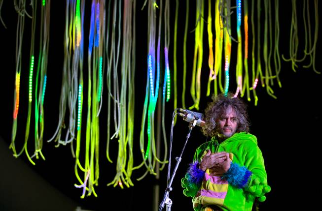 Mark Coyne of The Flaming Lips plays it up for an excited crowd as they perform on the Ambassador Stage during day 2 of the Life is Beautiful Festival on Friday, October 24, 2014.
