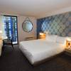 A bedroom is shown in a suite during the official opening of the Linq hotel-casino Thursday, Oct. 30, 2014. The property, formerly the Imperial Palace and The Quad, underwent a $223 million renovation in the transition.