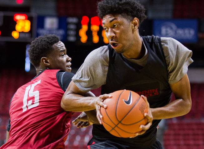 The UNLV basketball team's Christian Wood #5 turns the corner on teammate Dwayne Morgan #15 during a scrimmage on Saturday, November 1, 2014.