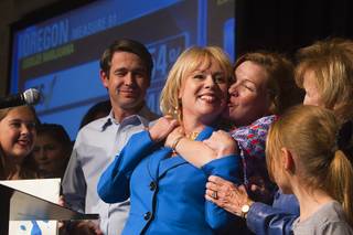 Congressional candidate Erin Bilbray gets a hug from her sister Shannon Bilbray-Axelrod after a concession speech during an election-night party for Democrats at MGM Grand on Tuesday, Nov. 4, 2014. Her husband Dr. Noah Kohn is at left. Bilbray was challenging Republican Congressman Joe Heck. 