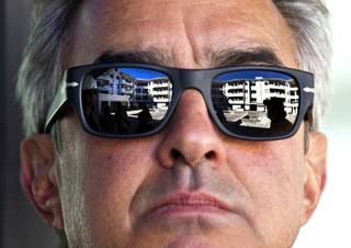 Benjy Garfinkle with WGH Partners has The Lennox development project reflected in his sunglasses, it close to being finished on Wednesday, October 29, 2014. L.E. Baskow.