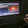 In this April 29, 2013, photo, a sample poker game is played on the Ultimate Gaming website in Las Vegas. Federal legalization of online poker appears to be unlikely with Republicans in charge of Congress.