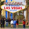 Tourists pose in front of the iconic Welcome to Fabulous Las Vegas sign in this file photo.