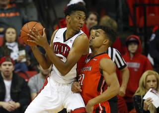UNLV forward Christian Wood (5) is covered by Sam Houston State guard Paul Baxter (21) as the UNLV Runnin' Rebels take on the Sam Houston State Bearkats at the Thomas & Mack Center Sunday, Nov. 16, 2014.