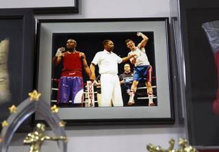 A photo on the wall at Barry's Boxing Center, 2664 S. Highland Drive, on Monday, Nov. 17, 2014. The photo, by then Las Vegas Sun photographer Ethan Miller, shows the reaction of Floyd Mayweather Jr., left, and Augie Sanchez after Sanchez beat Mayweather at the Olympic Trials in 1996. Mayweather came back to win the next two fights with Sanchez and qualified for the Olympics.