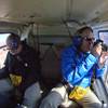 In this Oct. 5, 2013, photo, Geir Aase, left, and Kurt Raknes, tourists from Norway, take a helicopter tour over Grand Canyon National Park, near Tusayan, Ariz. A proposal by the Grand Canyon would give air tour operators another incentive to upgrade aircraft to meet the definition of quiet technology. 