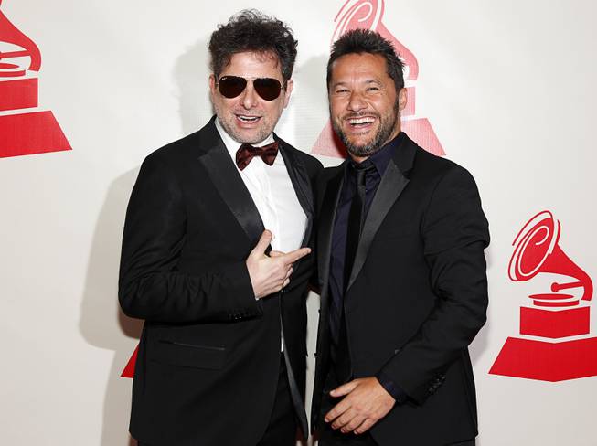 Musician Andres Calamaro (L) and singer Diego Torres arrive at the 2014 Latin Recording Academy Person of the Year Tribute to Joan Manuel Serrat at the Mandalay Bay Events Center Wednesday, Nov. 19, 2014.
