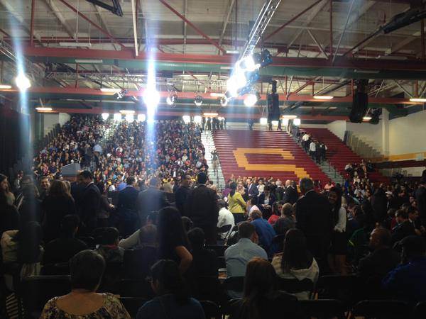 Students stream in to fill bleachers at Del Sol High School on Friday, Nov. 21, 2014, as they wait for President Barack Obama's arrival for a speech on his immigration reform plan. 