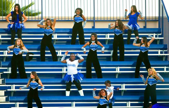 Desert Pines dancers perform in the stands during the Division I-A state high school football championship game on Saturday, November 22, 2014.