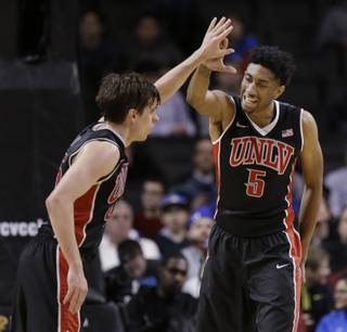 UNLV's Christian Wood, right, celebrates with Cody Doolin in the Rebels' 57-50 win against Temple in the Coaches vs. Cancer Classic on Saturday, Nov. 22, 2014, in New York.