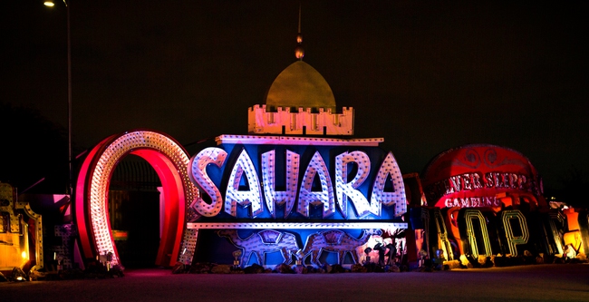 The Sahara sign bathed in blue light joins others at the Neon Museum Boneyards collection of more than 150 vintage neon signs now illuminated with a special, holiday-inspired palette of lights on Thursday, December 4, 2014.