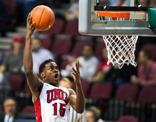 UNLV's Dwayne Morgan (15) gets high up for a short shot over the St. Katherine defense during their game at the Orleans Arena on Friday, December 5, 2014.