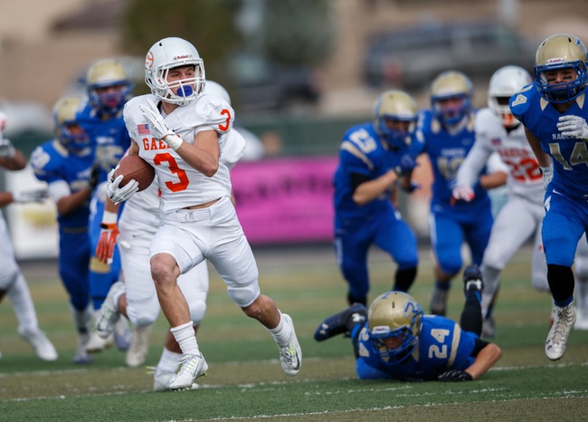Bishop Gorman Brandon Gahagan (3) returns the opening kickoff deep into Reed territory during the NIAA State Championship Football game between the Bishop Gorman Gaels and the Reed Raiders at Damonte Ranch High School in Reno, Nevada.