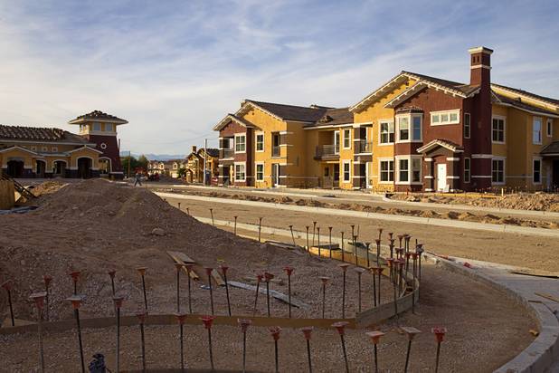 Construction continues on the Somerset Hills Apartments, 10695 S. Dean Martin Drive, Sunday, Dec. 7, 2014.