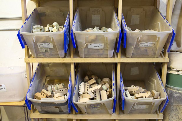 Bins hold a variety of toy car models at the Toys 4 Smiles workshop Monday, Dec. 8, 2014. The nonprofit organization started as a wood club in 2006 and will soon produce their 200,000th toy, said founder Rex Doty.