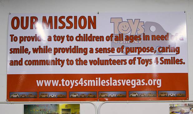 The mission statement is displayed on the wall at the Toys 4 Smiles workshop Monday, Dec. 8, 2014. The nonprofit organization started as a wood club in 2006 and will soon produce their 200,000th toy, said founder Rex Doty.