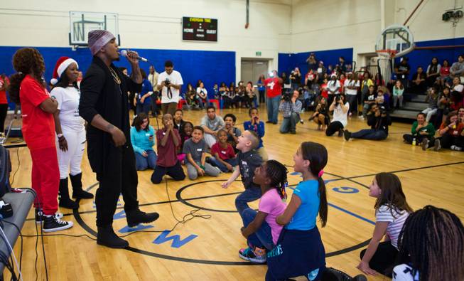 Singer Ne-Yo joins the Boys & Girls Clubs of Southern Nevada to meet the kids and help deliver 500 presents at the John Kish Boys & Girls Club on Wednesday, Dec. 10, 2014.