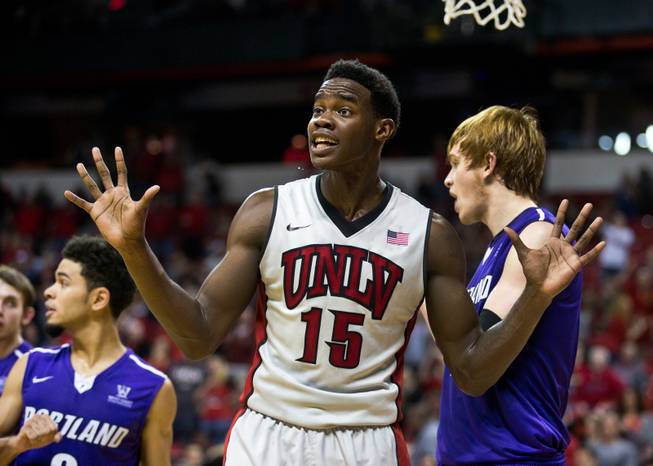 UNLV forward Dwayne Morgan (15) is certain he didn't cause a foul against visiting Portland at the Thomas & Mack Center on Wednesday, December 17, 2014.