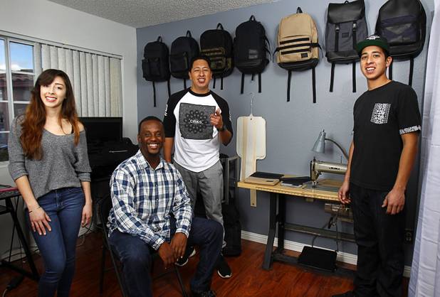 The Revive Brand Co. team poses in their home office Thursday, Dec. 18, 2014. From left:  Amanda Appling, creative director, Medin Gebrezgier, chief marketing officer, Jonathan Santos, CEO, and Cesar Santos, research and development/production manager.