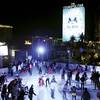 Skaters glide on the Cosmopolitan's ice rink Dec. 5, 2012, in Las Vegas. The resort turns its Boulevard pool into an ice rink during the holiday season. 