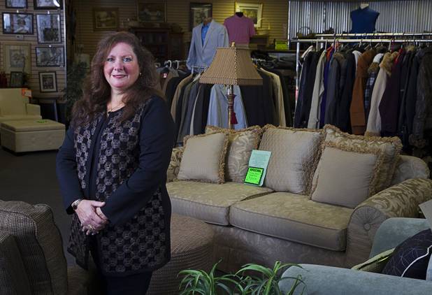 Michele Morgan-Devore, executive director of the nonprofit Dinosaurs & Roses thrift shop, 4310 E. Tropicana Ave., poses at the store Tuesday, Dec. 23, 2014.