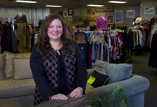 Michele Morgan-Devore, executive director of the nonprofit Dinosaurs & Roses thrift shop, 4310 E. Tropicana Ave., poses at the store Tuesday, Dec. 23, 2014.