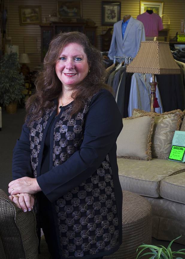 Michele Morgan-Devore, executive director of the nonprofit Dinosaurs & Roses thrift shop, 4310 E. Tropicana Ave., poses at the store Tuesday, Dec. 23, 2014.