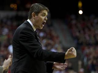 UNLV head coach Dave Rice is pumped as his team just needs to secure the ball for a win over Arizona at the Thomas & Mack Center on Tuesday, December 23, 2014.