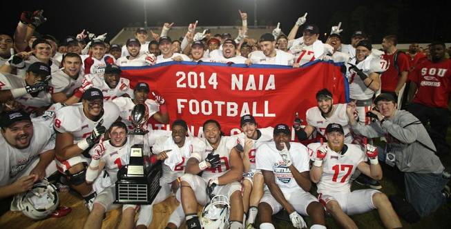 The Southern Oregon University football team celebrates its NAIA national championship. The program includes a handful from Las Vegas, each recruited by Las Vegas High graduate Josh Winfield.