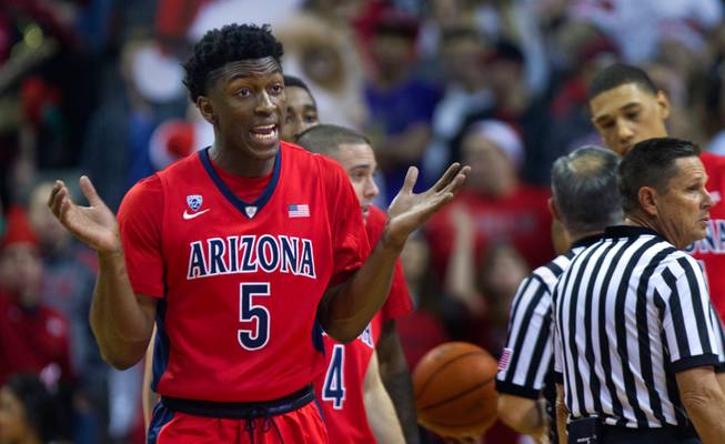 Arizona forward Stanley Johnson (5) does his best to play innocent after a double-technical foul at the Thomas & Mack Center on Tuesday, December 23, 2014.
