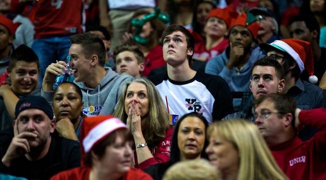 Stephen Zimmerman of Gorman High School joins other fans taking in the UNLV versus Arizona game at the Thomas & Mack Center on Tuesday, December 23, 2014.