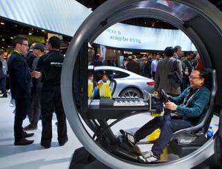 The Mercedes display area features a driver's experience as well as new vehicles to explore during CES 2015 at the Las Vegas Convention Center on Tuesday, January 6, 2015.