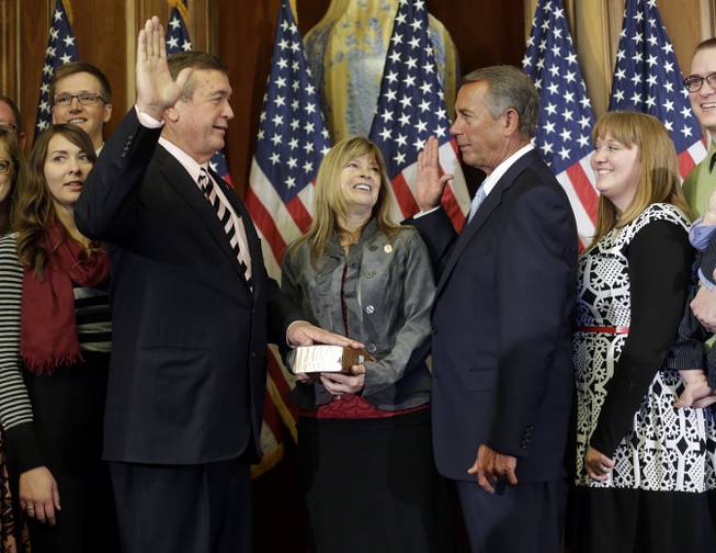 House Speaker John Boehner of Ohio, right, administers the House oath to Rep. Cresent Hardy, R-Nev., during a ceremonial re-enactment swearing-in ceremony, Tuesday, Jan. 6, 2015, in the Rayburn Room on Capitol Hill in Washington. 
