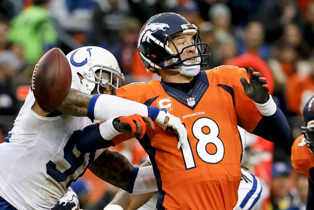 Colts stave off adversity to hand Peyton Manning, Broncos first