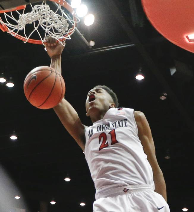 San Diego State forward Malik Pope dunks basket against UNLV during the first half of an NCAA college basketball game Saturday, Jan. 17, 2015, in San Diego. (AP Photo/Lenny Ignelzi)