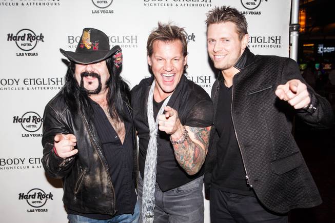 Chris Jericho, flanked by Vinnie Paul and Michael “The Miz” ...
