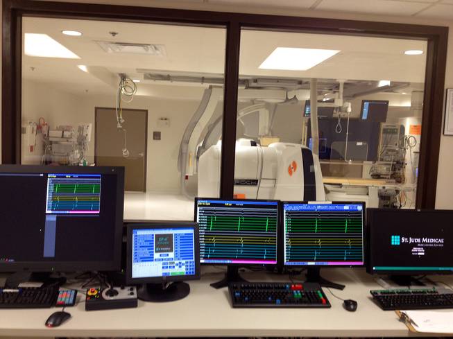 Computers are shown outside an operating room at Desert Springs Hospital, Tuesday, Jan. 20, 2015. A tech-savvy procedure involving magnets to fix heart arrhythmias has debuted at the hospital.