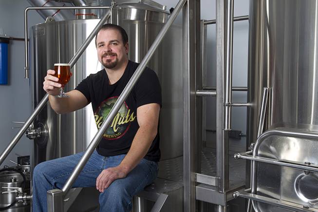 Owner Kevin Holder poses with a Green Mamba Double IPA at Hop Nuts brewery, 1120 South Main St. (next to Makers & Finders Urban Coffee Bar), Monday, Jan. 26, 2015. The brew pub is open now but will celebrate it's official grand opening on Feb. 13.