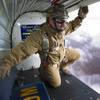Eddie Carroll, left, president of Vegas Extreme Skydiving, prepares for a jump over Jean, Nev. Tuesday, Jan. 27, 2015.