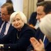 In this Jan. 15, 2015, photo, Federal Reserve Chairwoman Janet Yellen is acknowledged by International Monetary Fund Managing Director Christine Lagarde, right, with British Prime Minister David Cameron, during a roundtable meeting at the IMF in Washington. 