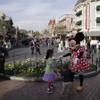 Minnie Mouse dances with visitors at Disneyland, Thursday, Jan. 22, 2015, in Anaheim, Calif. 
