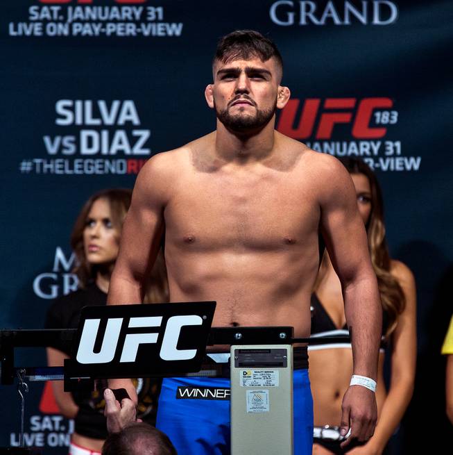 Welterweight fighter Kelvin Gastelum is unhappy with being 10 lbs. over during the UFC183 fighter weigh ins at the MGM Grand Garden Arena on Friday, January 30, 2015.