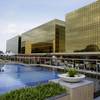 Guests enjoy swimming in a pool at the newly-opened City of Dreams Manila casino Monday, Feb. 2, 2015 at the reclaimed prime property in Manila, Philippines.