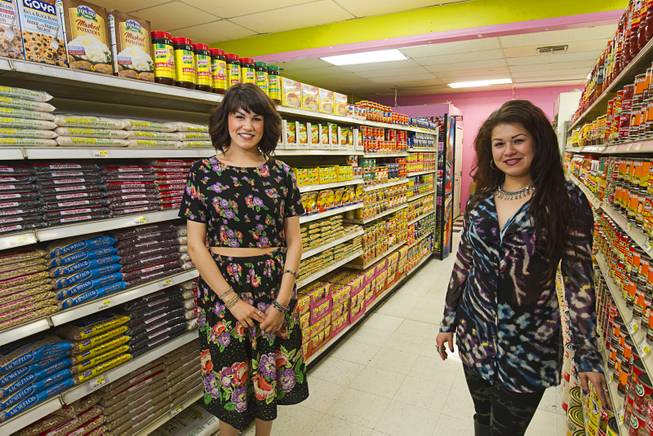 Sisters Gabriella, left, and Faviola Trujillo pose at Los Compadres #4, a family-owned market, on East Tropicana Avenue Wednesday, Feb. 4, 2015. A Cardenas supermarket opened across the street from the market in in Nov. 2014.