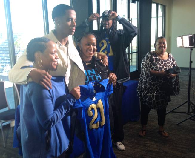 Bishop Gorman High football player Cordell Broadus is joined by family members, including dad Snoop Dogg, after announcing he'd play in college at UCLA.